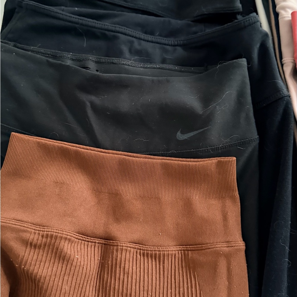 Variety of workout leggings and tops.